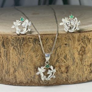 Silver pendant and earrings set with natural rough Colombian emeralds